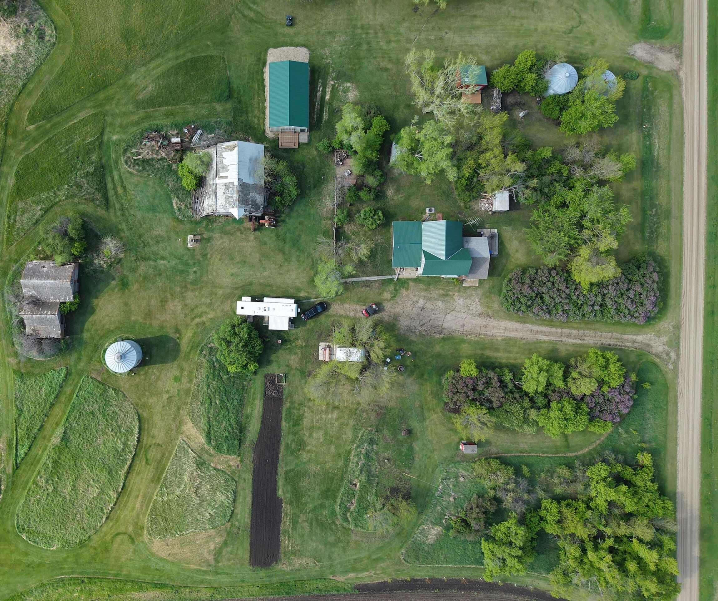Farmstead Picture Picture of an aging farmstead with a house, barn, garden, and other structures.